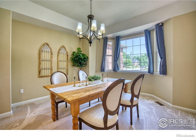 2408 Eagleview Cir, Longmont, CO 80504 - dining area with a chandelier and light carpet