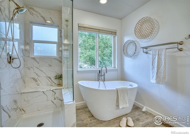 2408 Eagleview Cir, Longmont, CO 80504 - full bath featuring a marble finish shower and a freestanding tub