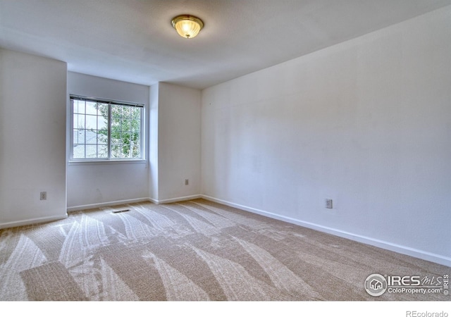 2408 Eagleview Cir, Longmont, CO 80504 - empty room with carpet floors and baseboards