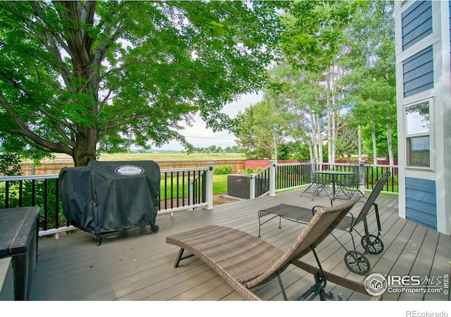 2408 Eagleview Cir, Longmont, CO 80504 - wooden deck with a fenced backyard and area for grilling