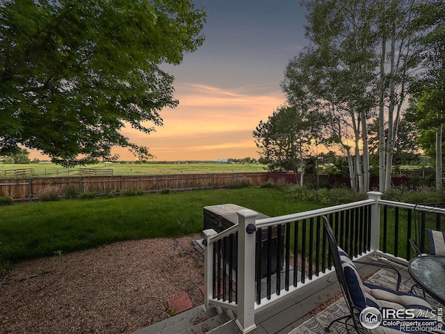2408 Eagleview Cir, Longmont, CO 80504 - fenced backyard with a wooden deck and a view of countryside