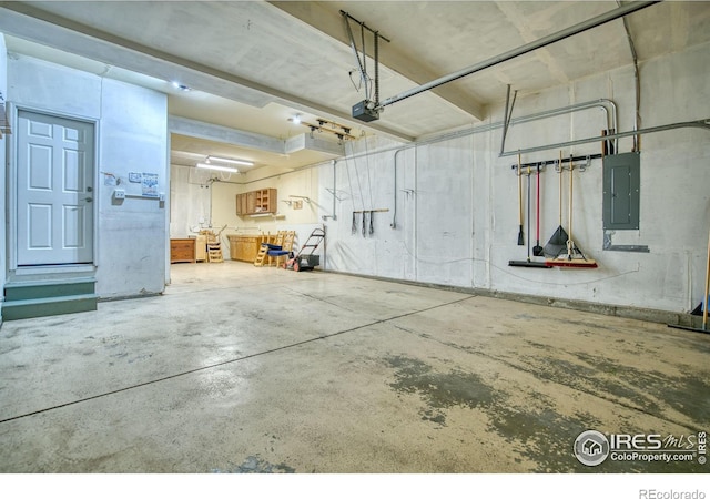 2408 Eagleview Cir, Longmont, CO 80504 - garage featuring electric panel and a garage door opener