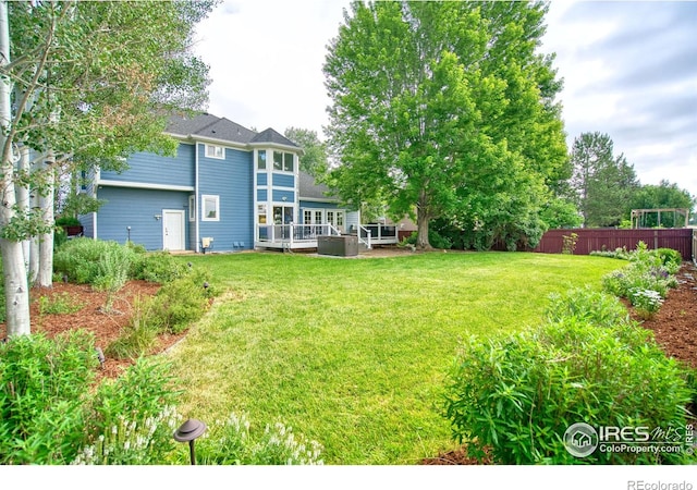 2408 Eagleview Cir, Longmont, CO 80504 - view of yard featuring a deck
