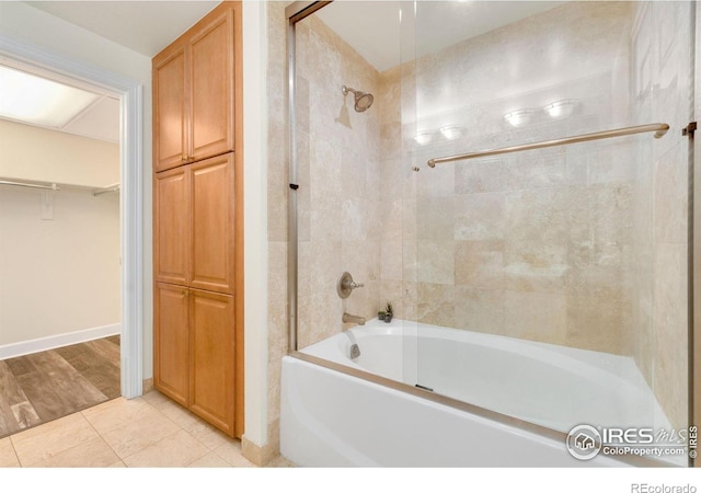 1827 N Grant St Unit 604, Denver, CO 80203 - full bath featuring shower / bathtub combination, tile patterned flooring, and a walk in closet