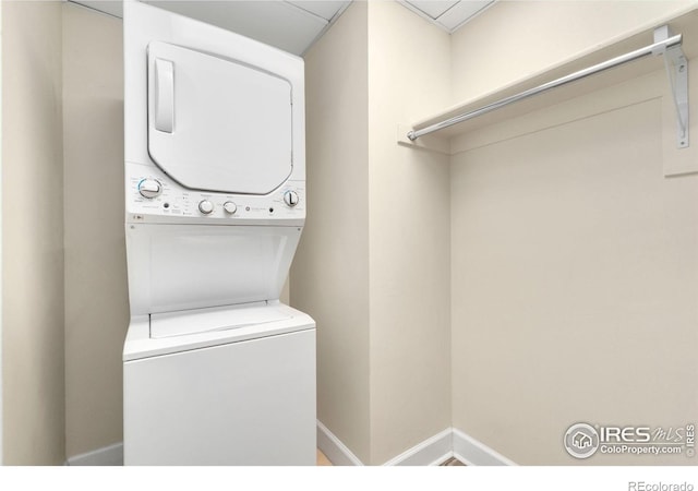 1827 N Grant St Unit 604, Denver, CO 80203 - laundry room featuring stacked washer / drying machine and baseboards