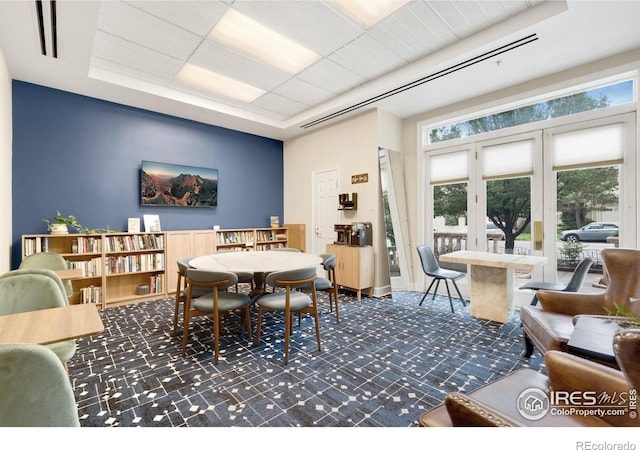 1827 N Grant St Unit 604, Denver, CO 80203 - dining room featuring carpet and a tray ceiling