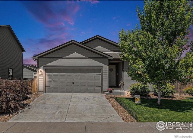 2065 Wildwood St, Lochbuie, CO 80603 - single story home with driveway and a garage