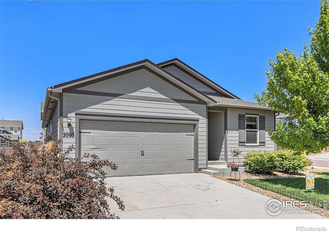 2065 Wildwood St, Lochbuie, CO 80603 - ranch-style home featuring an attached garage and concrete driveway