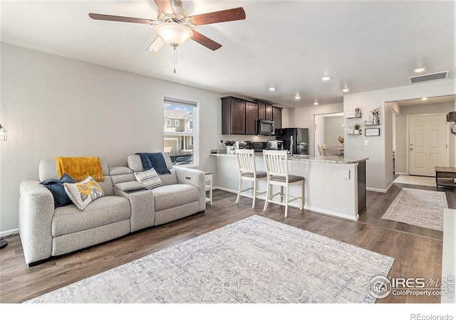 2065 Wildwood St, Lochbuie, CO 80603 - living area with a ceiling fan, recessed lighting, and dark wood finished floors