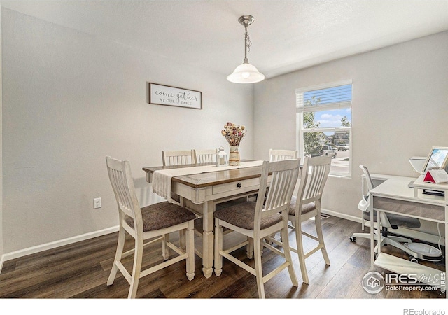 2065 Wildwood St, Lochbuie, CO 80603 - dining space featuring wood finished floors and baseboards