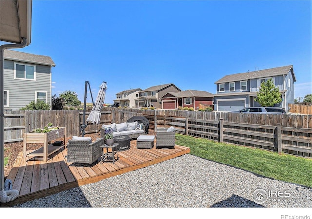 2065 Wildwood St, Lochbuie, CO 80603 - wooden deck with outdoor lounge area, a fenced backyard, and a residential view
