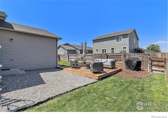 2065 Wildwood St, Lochbuie, CO 80603 - fenced backyard featuring outdoor lounge area, a wooden deck, and a residential view