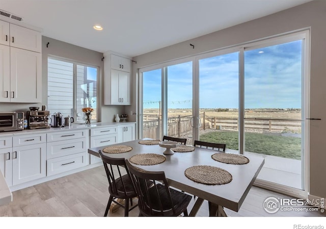 6645 Dry Fork Dr, Frederick, CO 80516 - dining space featuring light wood-style flooring and recessed lighting
