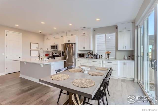6645 Dry Fork Dr, Frederick, CO 80516 - dining room featuring light wood finished floors and recessed lighting