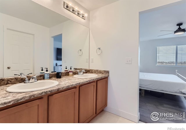 6645 Dry Fork Dr, Frederick, CO 80516 - full bathroom featuring connected bathroom, double vanity, and ceiling fan