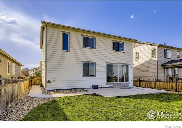 6645 Dry Fork Dr, Frederick, CO 80516 - back of property with a patio area and a fenced backyard