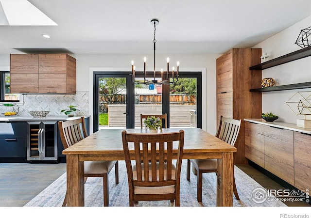 3275 19th St, Boulder, CO 80304 - dining space with wine cooler, a chandelier, wood finished floors, and recessed lighting
