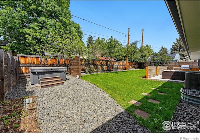 3275 19th St, Boulder, CO 80304 - fenced backyard featuring a hot tub, outdoor lounge area, and a patio area