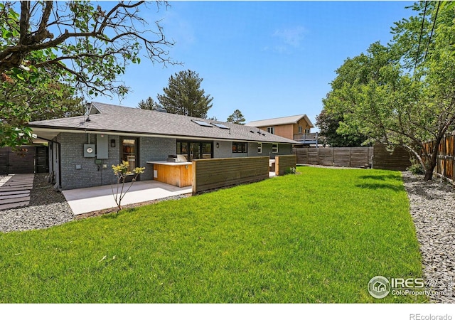 3275 19th St, Boulder, CO 80304 - back of house featuring a fenced backyard, a patio, and brick siding