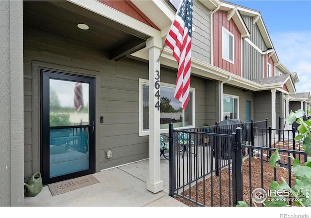 3644 Ronald Reagan Ave, Wellington, CO 80549 - property entrance with board and batten siding and covered porch