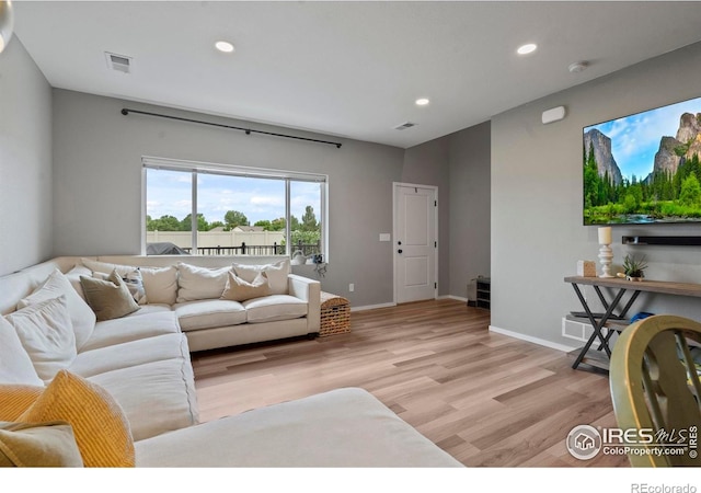 3644 Ronald Reagan Ave, Wellington, CO 80549 - living room featuring light wood-style floors and recessed lighting