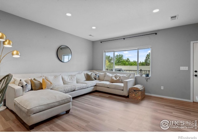 3644 Ronald Reagan Ave, Wellington, CO 80549 - living room featuring light wood-style floors and recessed lighting