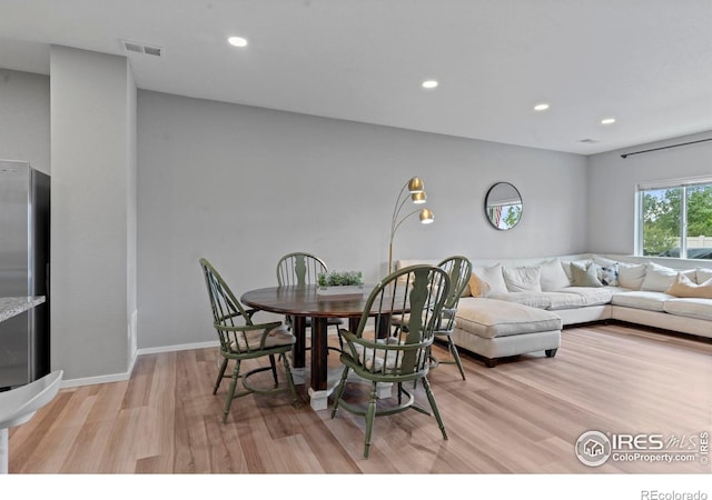 3644 Ronald Reagan Ave, Wellington, CO 80549 - dining area with light wood-style flooring and recessed lighting