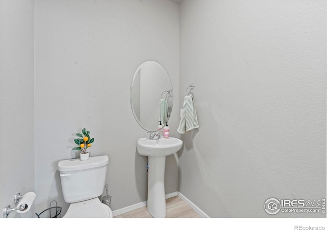 3644 Ronald Reagan Ave, Wellington, CO 80549 - bathroom with toilet and baseboards
