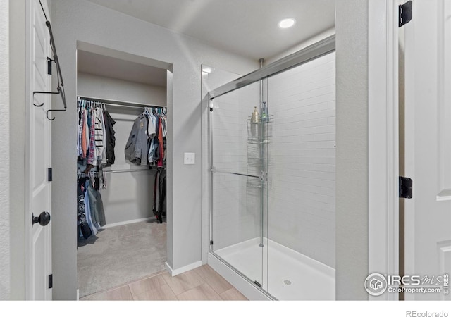 3644 Ronald Reagan Ave, Wellington, CO 80549 - bathroom featuring a stall shower and a spacious closet