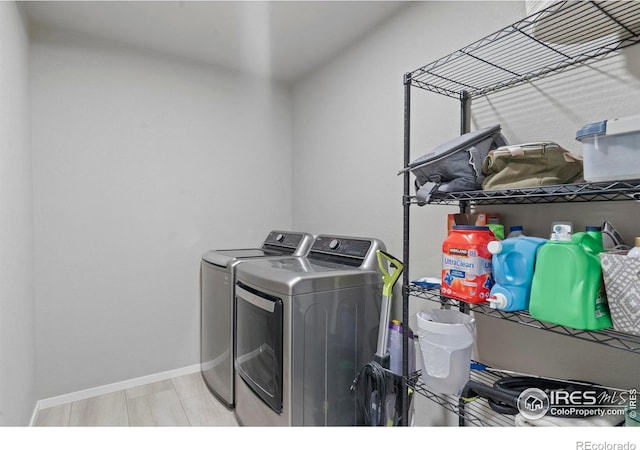 3644 Ronald Reagan Ave, Wellington, CO 80549 - washroom with washer and clothes dryer and baseboards