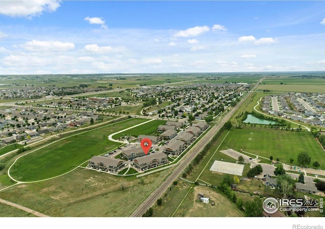 3644 Ronald Reagan Ave, Wellington, CO 80549 - aerial view of property and surrounding area with nearby suburban area and a nearby body of water