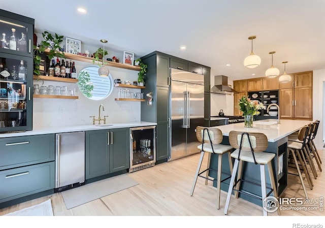 1405 Clover Creek Dr, Longmont, CO 80503 - kitchen with wine cooler, built in refrigerator, refrigerator, open shelves, and light countertops
