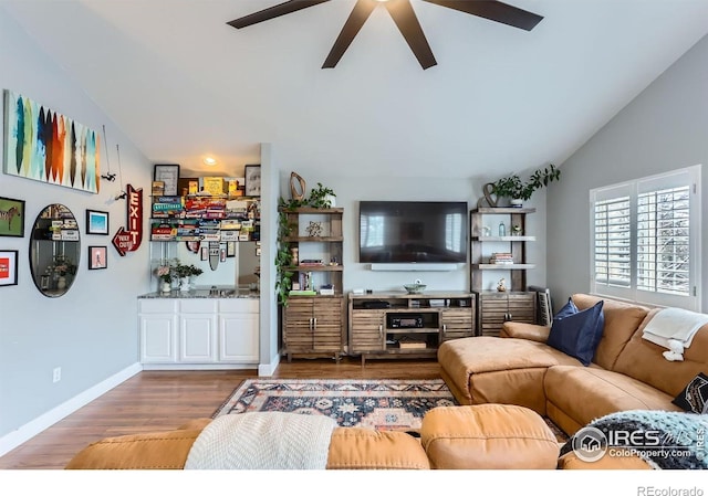 1405 Clover Creek Dr, Longmont, CO 80503 - living room with ceiling fan, wood finished floors, and vaulted ceiling