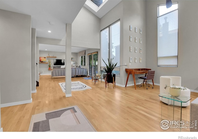 3470 16th St, Boulder, CO 80304 - entrance foyer featuring wood finished floors, a high ceiling, and a skylight