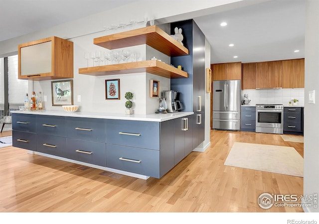 3470 16th St, Boulder, CO 80304 - kitchen featuring appliances with stainless steel finishes, light wood finished floors, open shelves, backsplash, and modern cabinets