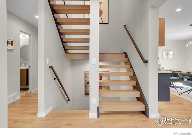 3470 16th St, Boulder, CO 80304 - staircase featuring wood finished floors and recessed lighting