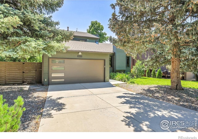 3470 16th St, Boulder, CO 80304 - view of front of property featuring concrete driveway, an attached garage, and stucco siding