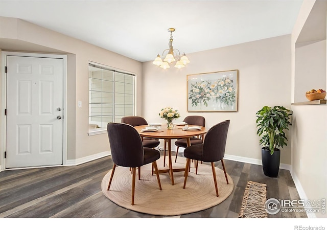 2502 Timberwood Dr Unit 104, Fort Collins, CO 80528 - dining room featuring dark wood-type flooring and a chandelier