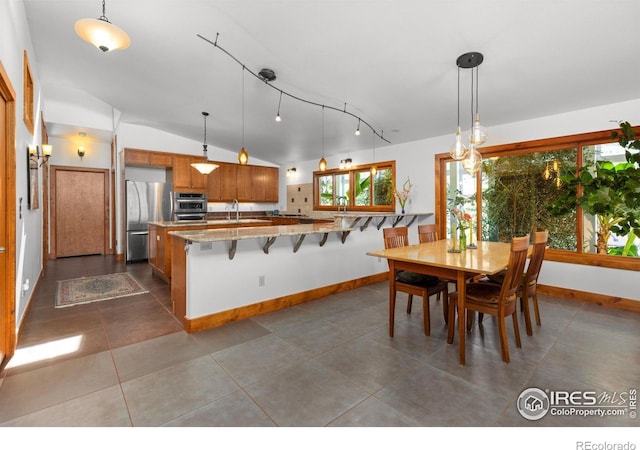 108 Lonestar Rd, Lyons, CO 80540 - dining area with dark tile patterned flooring and lofted ceiling