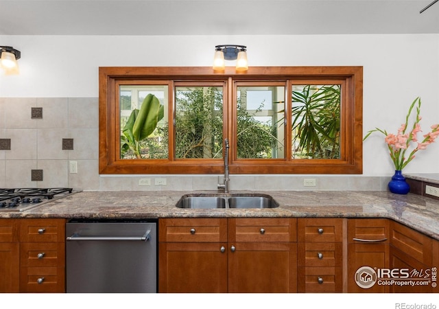 108 Lonestar Rd, Lyons, CO 80540 - kitchen featuring appliances with stainless steel finishes, brown cabinetry, and light stone countertops