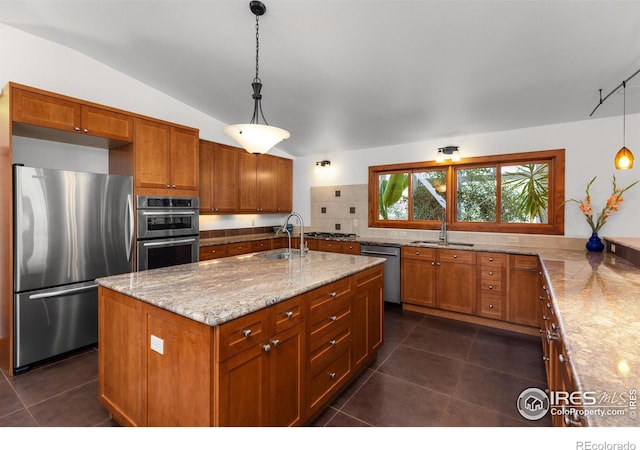 108 Lonestar Rd, Lyons, CO 80540 - kitchen featuring stainless steel appliances, brown cabinets, tasteful backsplash, and lofted ceiling