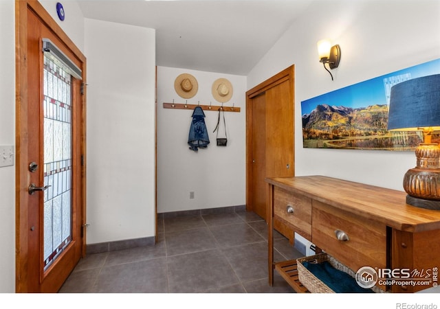 108 Lonestar Rd, Lyons, CO 80540 - foyer with dark tile patterned flooring and baseboards