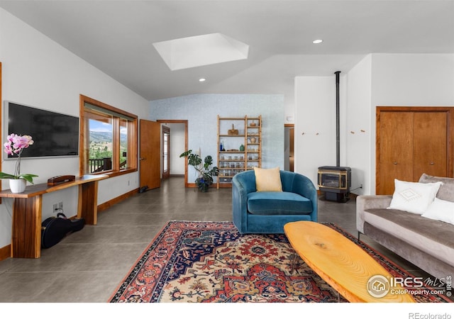 108 Lonestar Rd, Lyons, CO 80540 - living room featuring a skylight, a wood stove, vaulted ceiling, and recessed lighting