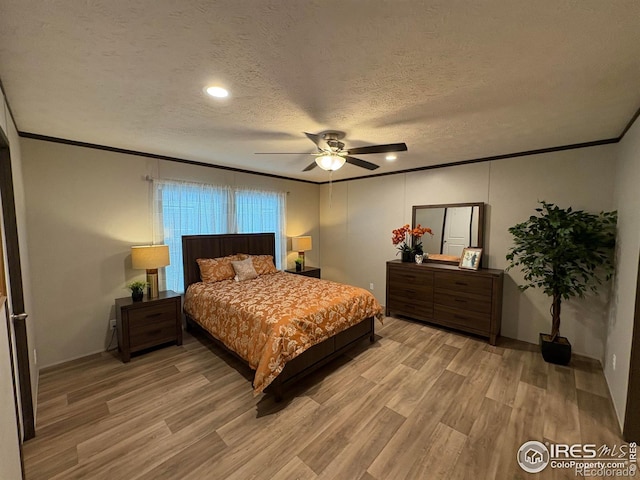 48990 County Road 41, Nunn, CO 80648 - bedroom featuring ornamental molding, light wood-type flooring, a textured ceiling, ceiling fan, and recessed lighting