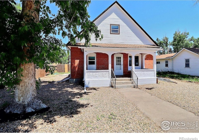 263 E 2nd St, Ault, CO 80610 - view of front of property featuring a porch and brick siding