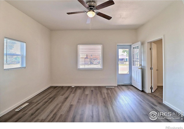 263 E 2nd St, Ault, CO 80610 - spare room with plenty of natural light, wood finished floors, and a ceiling fan