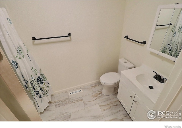 263 E 2nd St, Ault, CO 80610 - bathroom featuring marble look tiles and vanity