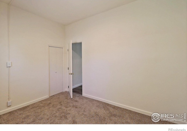 263 E 2nd St, Ault, CO 80610 - carpeted spare room featuring baseboards