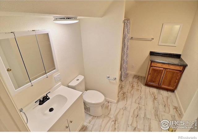 263 E 2nd St, Ault, CO 80610 - bathroom with marble finish flooring, vanity, and a shower with curtain