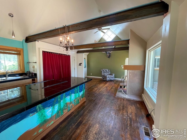 383 Evergreen Rd, Black Hawk, CO 80422 - kitchen featuring dark wood-style floors, a ceiling fan, tile counters, pendant lighting, and black stovetop